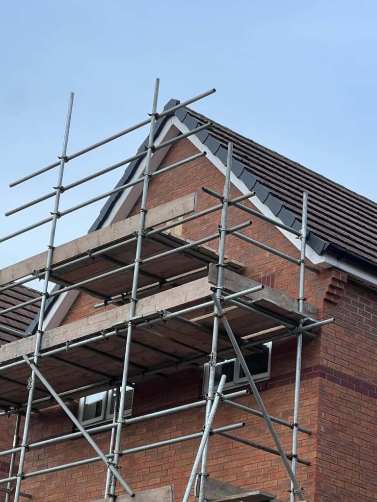 This is a photo of a roof which has just been repaired. There is a scaffold located at the gable end for access onto the roof. Works carried out by MCM Roofing Repairs Frome